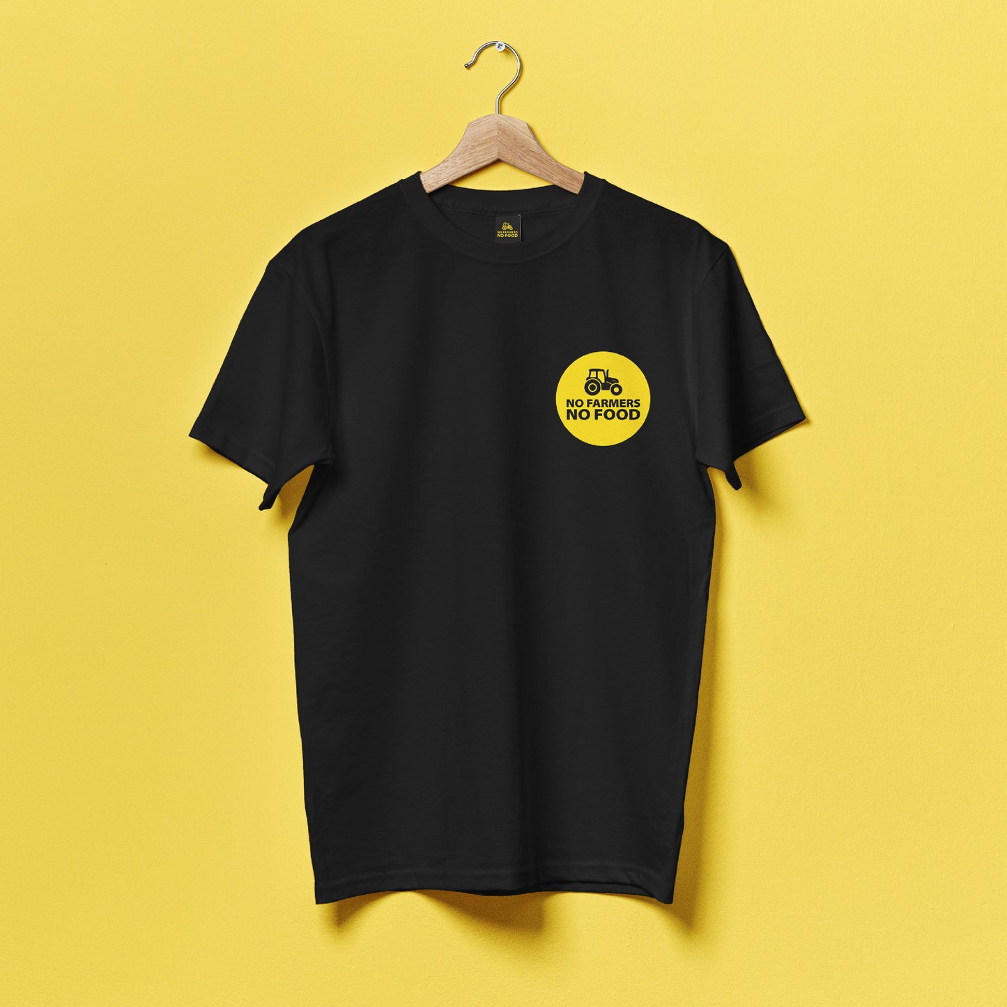 No Farmers No Food black on yellow logo on front of a black t-shirt
