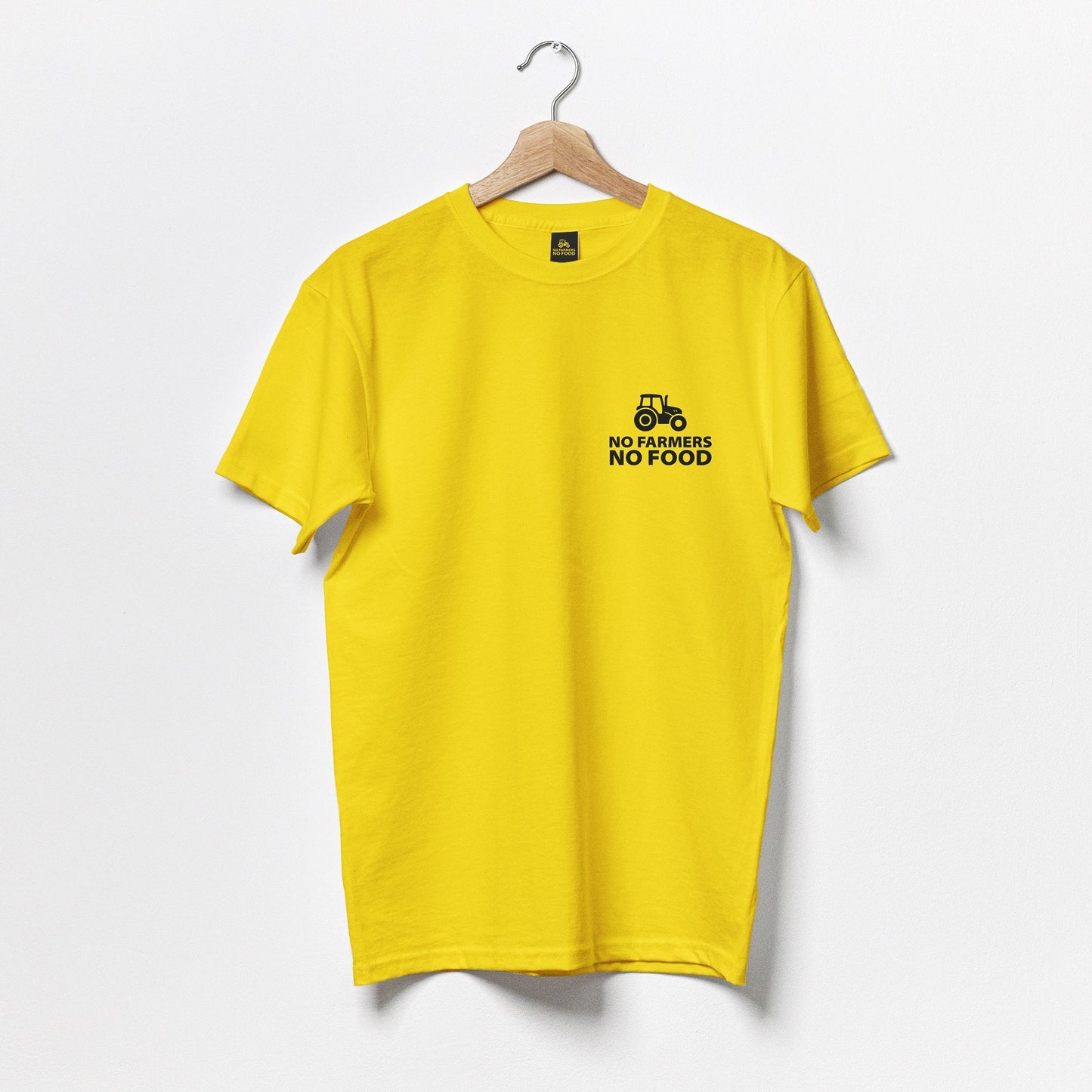 No Farmers No Food black logo on front of a yellow t-shirt